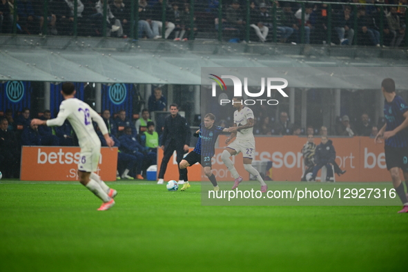 Nicolo Barella of Inter Milan and Cher Ndour of AFC Fiorentina battle for the ball during the Serie A match between Inter Milan and AFC Fior... by Andrea Diodato/NurPhoto