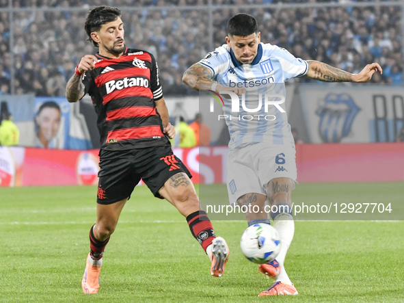 Giorgian de Arrascaeta (left) and Marcos Rojo (right) play in the match between Racing Club and Flamengo for the semifinals of the Copa Libe... by Facundo Morales/NurPhoto