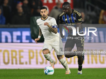 Mattia Zaccagni of S.S. Lazio and Idrissa Toure of Pisa S.C. 1909 are in action during the 9th day of the Serie A Championship between Pisa... by Domenico Cippitelli/NurPhoto