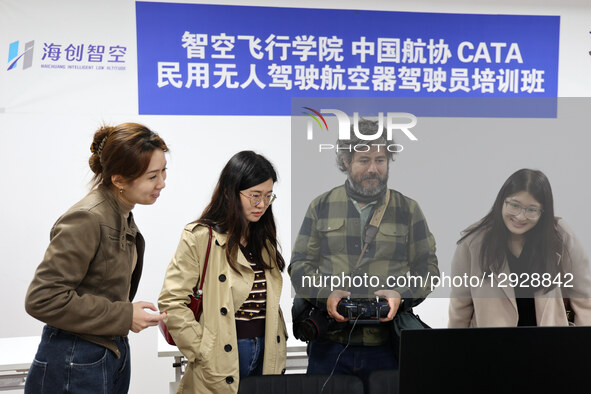 Foreign guests experience simulated flight operations at a drone manufacturing enterprise in the Binzhou High-tech Industrial Development Zo... by Costfoto/NurPhoto