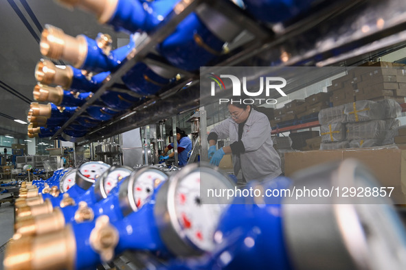 A worker works at a smart water meter manufacturing enterprise in Qingzhou Economic Development Zone, Qingzhou City, Shandong Province, Chin... by Costfoto/NurPhoto