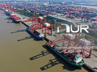 Cargo ships load and unload containers in Longtan Port Area of Nanjing Port, Nanjing City, Jiangsu Province, China, on October 31, 2025.  by Costfoto/NurPhoto