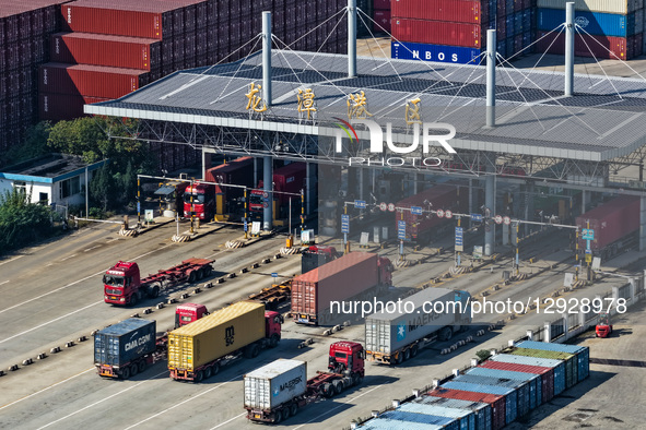 Trucks transport containers in Longtan Port Area of Nanjing Port, Nanjing City, Jiangsu Province, China, on October 31, 2025.  by Costfoto/NurPhoto