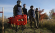 Participants go through a first aid drill during humanitarian demining training for war ve...