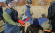 Participants carry a man on a stretcher as part of a first aid drill during humanitarian d...