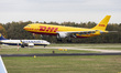 Airbus A300 freight aircraft of DHL Aviation flying and landing at Eindhoven airport with...