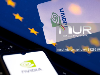 The Nvidia logo appears on a smartphone screen, and the European Flag displays as the background on a laptop screen in this photo illustrati... by Nikolas Kokovlis/NurPhoto