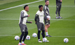 Players of Real Madrid, from left to right, Eder Militao and Endrick Felipe, train during...