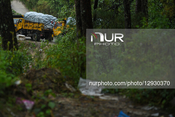 Garbage trucks carrying waste from Kathmandu remain halted on the way after obstructions at the Bancharhedanda landfill site in Nuwakot, Nep... by Safal Prakash Shrestha/NurPhoto