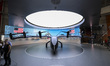 Visitors take photographs of the Archer Midnight electric vertical takeoff and landing air...