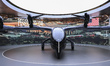 Visitors take photographs of the Archer Midnight electric vertical takeoff and landing air...