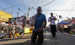 A devotee attends the altar of Santa Muerte located on Alfareria Street in the neighborhoo...
