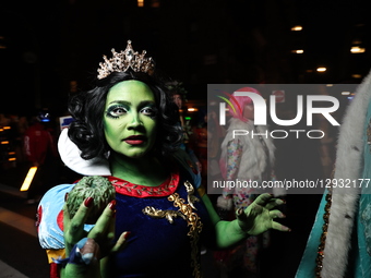 A woman dressed as an evil green queen marches during the Greenwich Village Halloween Parade in New York, United States, on October 31, 2025... by Gordon Donovan/NurPhoto
