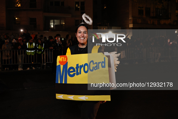 A woman dressed as a New York City Transit Metro Card marches during the Greenwich Village Halloween Parade in New York, United States, on O... by Gordon Donovan/NurPhoto