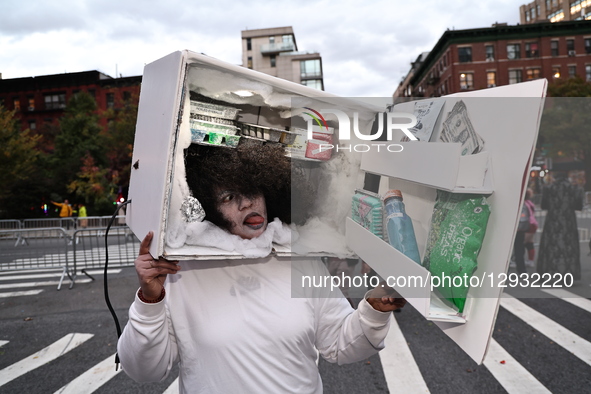 Cosplayer Yanina from Astoria, New York, dresses as a walking freezer and poses for a photo during New York's 52nd Annual Village Halloween... by Gordon Donovan/NurPhoto