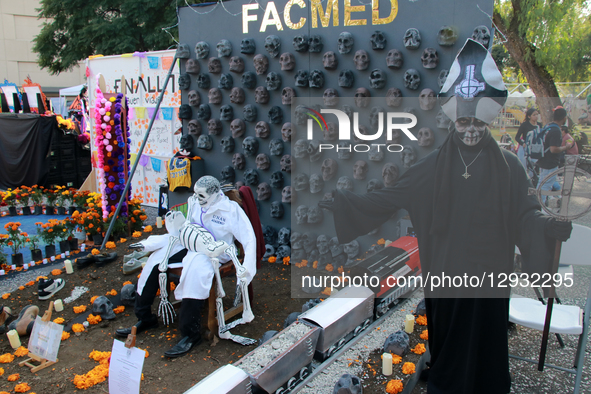 A man dressed in Day of the Dead attire poses next to the mega-altar of the National Autonomous University of Mexico (UNAM) on the occasion... by Jose Luis Torales/NurPhoto