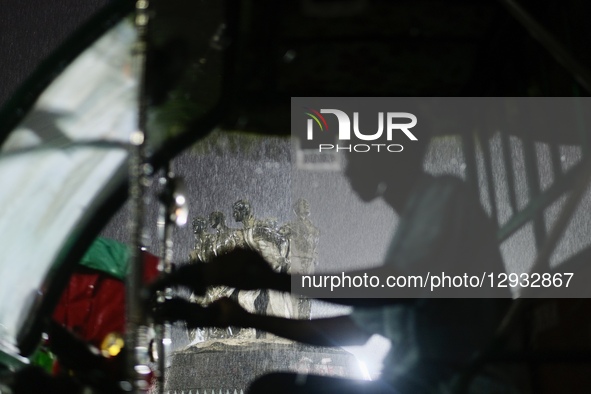 A rickshaw puller rides through the rain in Dhaka, Bangladesh, on November 1, 2025.  by Syed Mahamudur Rahman/NurPhoto