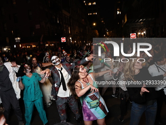 Performers on the Thriller float entertain the crowd during New York's 52nd Annual Village Halloween Parade in New York, N.Y., on October 31... by Gordon Donovan/NurPhoto