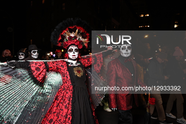 Revelers dress for The Day of the Dead and march before New York's 52nd Annual Village Halloween Parade in New York, N.Y., on October 31, 20... by Gordon Donovan/NurPhoto