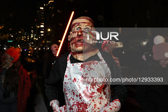 A man resembling a victim of a horror movie poses for a photo during the 52nd Annual Village Halloween Parade in New York, N.Y., on October... by Gordon Donovan/NurPhoto