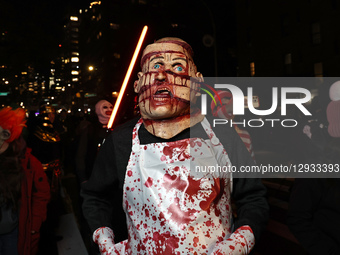 A man resembling a victim of a horror movie poses for a photo during the 52nd Annual Village Halloween Parade in New York, N.Y., on October... by Gordon Donovan/NurPhoto
