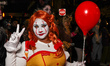 A woman dressed as Pennywise poses for a photo during New York's 52nd Annual Village Hallo...