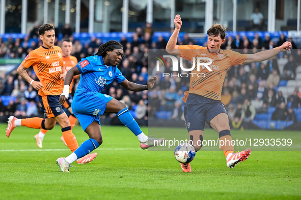 Abraham Odoh (10 Peterborough United) shoots during the Emirates FA Cup First Round match between Peterborough and Cardiff City at London Ro... by MI News/NurPhoto