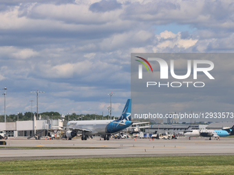 Airplanes are at Quebec City Jean Lesage International Airport in Quebec City, Quebec, Canada, on July 22, 2025.  by Creative Touch Imaging Ltd/NurPhoto