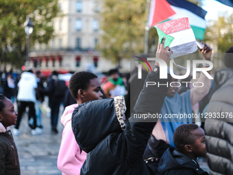 Children raise Sudanese flags during a demonstration following the massacres by Abu Lulu's Rapid Support Forces in El Fasher, in Paris, Fran... by Vincent Koebel/NurPhoto