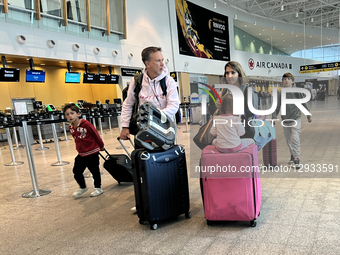 Travelers are at Quebec City Jean Lesage International Airport in Quebec City, Quebec, Canada, on July 22, 2025.  by Creative Touch Imaging Ltd/NurPhoto