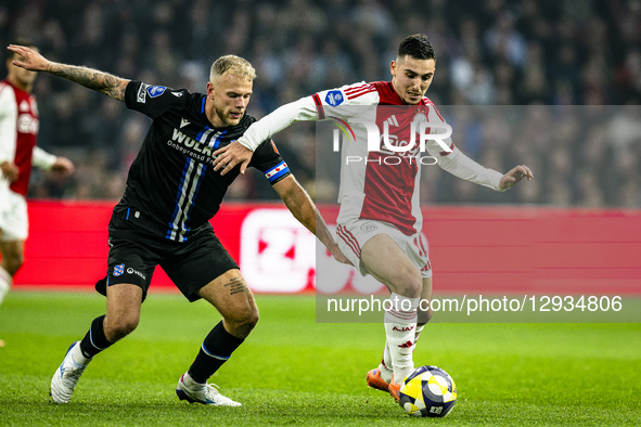 SC Heerenveen midfielder Luuk Brouwers and AFC Ajax Amsterdam midfielder Oscar Gloukh play during the match between AFC Ajax Amsterdam and S... by EYE4images/NurPhoto