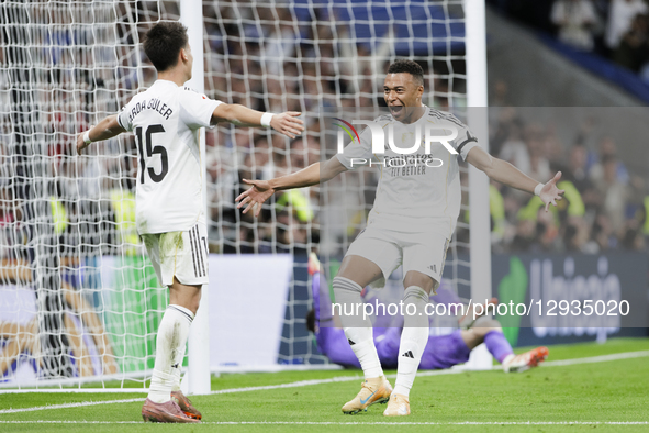 Kylian Mbappe of Real Madrid and Arda Guler of Real Madrid celebrate a goal during the La Liga 2025/26 match between Real Madrid and Valenci... by Guillermo Martinez/NurPhoto
