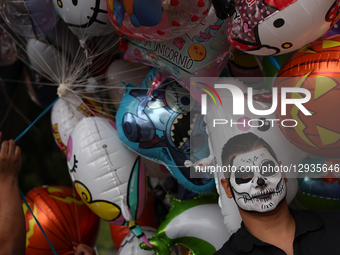 A person with painted face takes part in the Day of the Dead parade in Mexico City, Mexico on November 1, 2025.  by Jakub Porzycki/NurPhoto