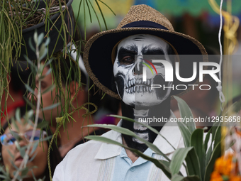 A person with painted face takes part in the Day of the Dead parade in Mexico City, Mexico on November 1, 2025.  by Jakub Porzycki/NurPhoto