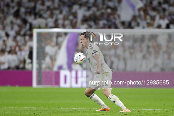 Alvaro Carreras of Real Madrid controls the ball during the La Liga 2025/26 match between Real Madrid and Valencia at Santiago Bernabeu Stad... by Guillermo Martinez/NurPhoto