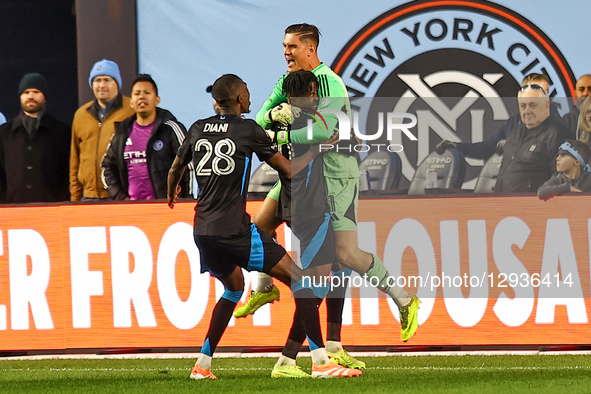 Charlotte FC goalkeeper Kristijan Kahlina #1 is mobbed by teammates after defeating New York City FC in a shootout in the first round of MLS... by Gordon Donovan/NurPhoto