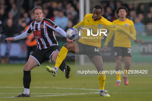 Matty Dolan of Spennymoor Town and Rekeem Harper of Barrow AFC participate in the Emirates FA Cup First Round match between Spennymoor Town... by MI News/NurPhoto