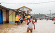 A man walks through floodwaters near the nickel industrial area owned by Indonesia Weda Ba...