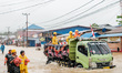 A male miner walks through floodwaters around the nickel industrial area owned by Indonesi...