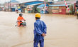 A male miner walks through floodwaters around the nickel industrial area owned by Indonesi...