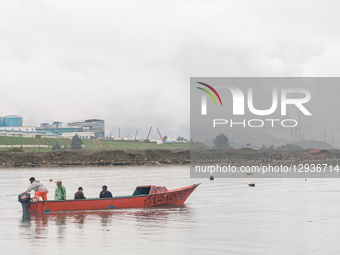 Fishermen carry a boat around the nickel industrial area owned by Indonesia Weda Bay Industrial Park (IWIP) in Weda Bay, on Halmahera Island... by Muhammad Fauzy/NurPhoto