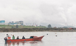 Fishermen carry a boat around the nickel industrial area owned by Indonesia Weda Bay Indus...