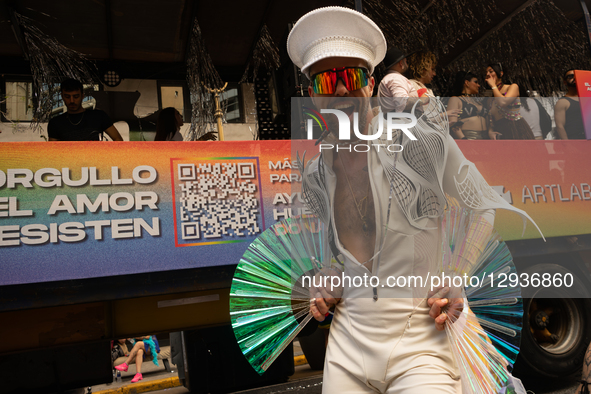 A protester poses in front of a parade float before the start of the parade, in Buenos Aires, Argentina, on November 1, 2025.  by Guillermo Castro/NurPhoto