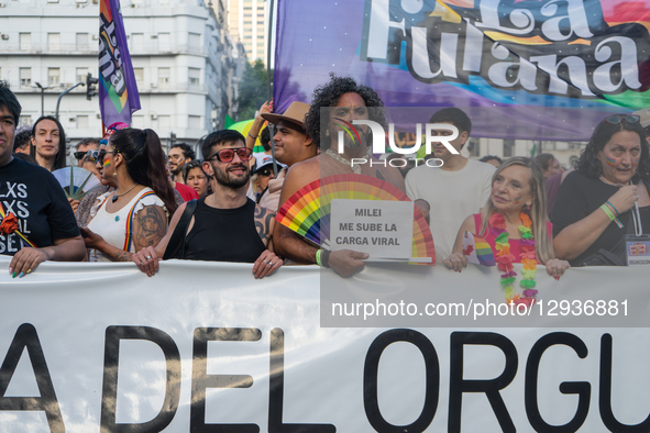 A protester holds up a placard with a slogan against Milei, in Buenos Aires, Argentina, on November 1, 2025.  by Guillermo Castro/NurPhoto