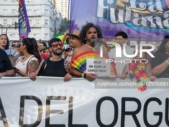 A protester holds up a placard with a slogan against Milei, in Buenos Aires, Argentina, on November 1, 2025.  by Guillermo Castro/NurPhoto