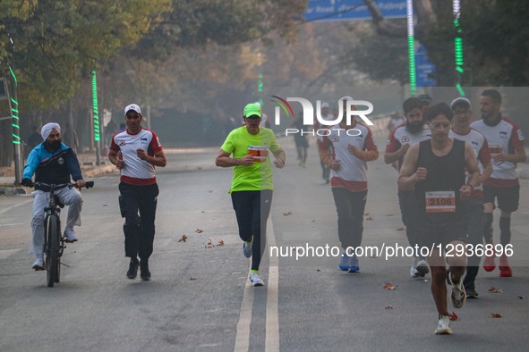 Omar Abdullah, Chief Minister of India's Jammu and Kashmir region, runs during the Kashmir Marathon in Srinagar, Jammu and Kashmir, on Novem... by Firdous Nazir/NurPhoto