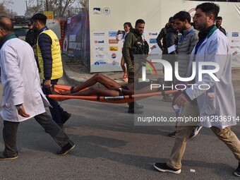 A participant is carried onto a stretcher after she faints during the Kashmir Marathon in Srinagar, Jammu and Kashmir, on November 2, 2025.... by Firdous Nazir/NurPhoto