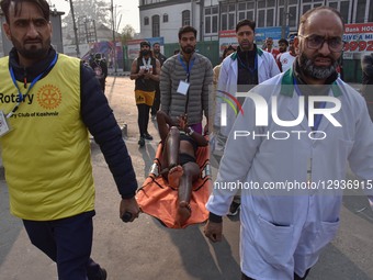 A participant is carried onto a stretcher after she faints during the Kashmir Marathon in Srinagar, Jammu and Kashmir, on November 2, 2025.... by Firdous Nazir/NurPhoto