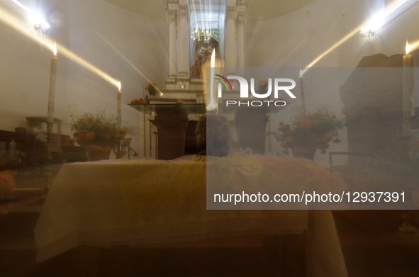 A view of a skull inside a chapel in the Sierra Madre Sur of Mexico, where dozens of people gather for a Day of the Dead procession. They pl... by Gerardo Vieyra/NurPhoto