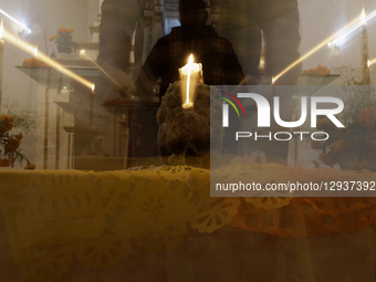 A view of a skull inside a chapel in the Sierra Madre Sur of Mexico, where dozens of people gather for a Day of the Dead procession. They pl... by Gerardo Vieyra/NurPhoto